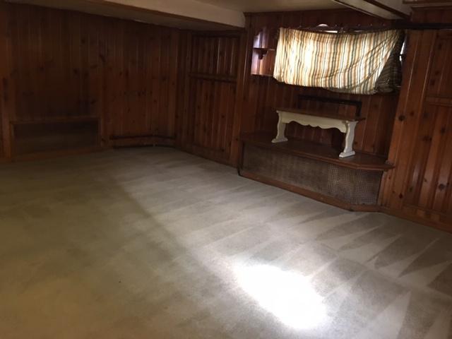 5514 North Mango Avenue, Unit G Chicago, IL 60630 - Photo 6 of 8 a view of an empty room with a fireplace