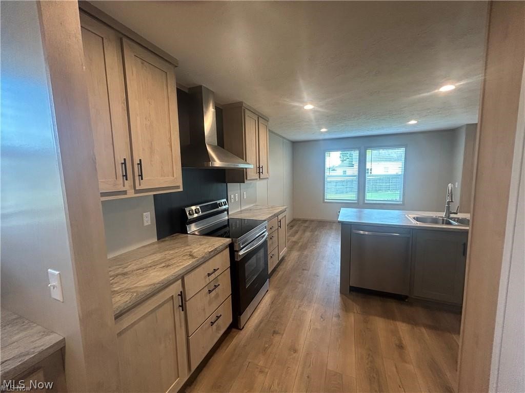 252 Front Street Philo, OH 43771 - Photo 6 of 17 Kitchen with stainless steel appliances, light wood-style floors, and recessed lighting