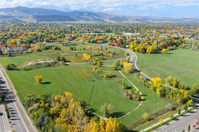 an aerial view of a residential houses with outdoor space
