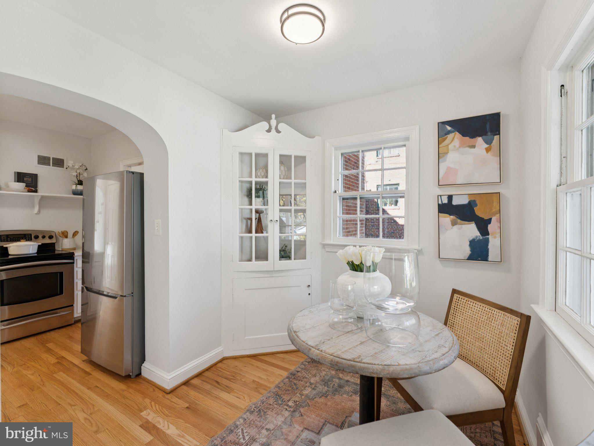 4821 45th Street Northwest Washington, DC 20016 - Photo 16 of 38 a view of a dining room with furniture and a chandelier