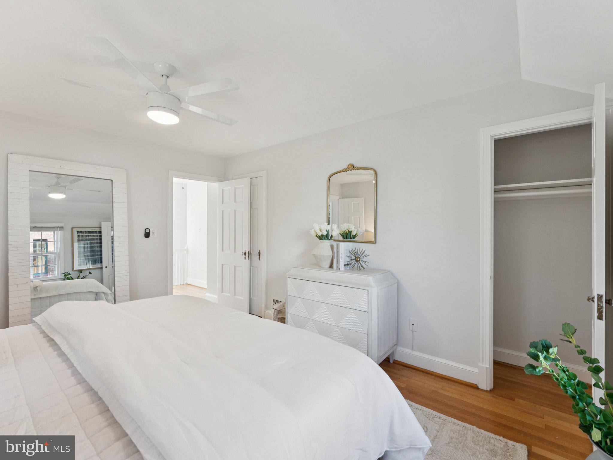 4821 45th Street Northwest Washington, DC 20016 - Photo 21 of 38 a spacious bedroom with a bed and a dresser