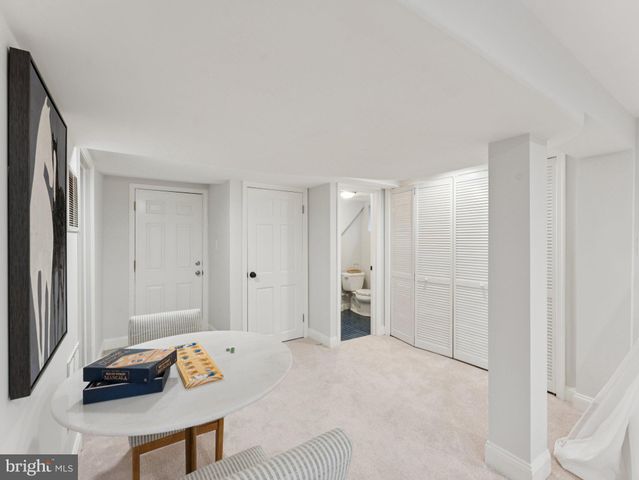 a spacious bedroom with a bed and a table in it