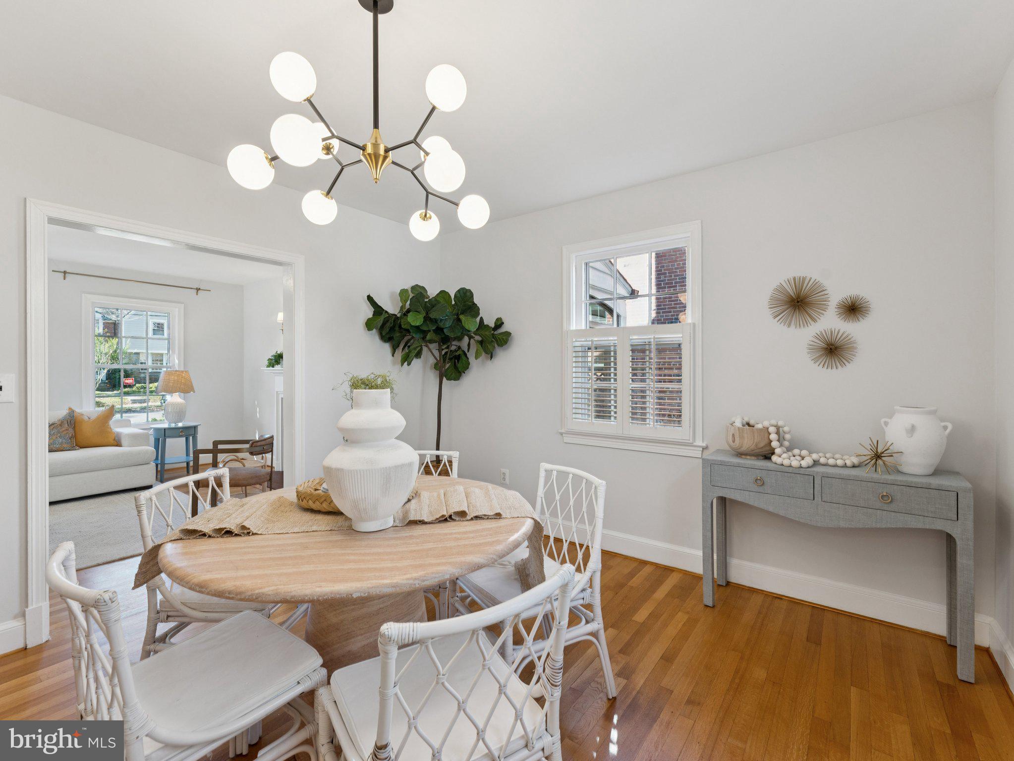 4821 45th Street Northwest Washington, DC 20016 - Photo 10 of 38 a view of a dining room with furniture and chandelier