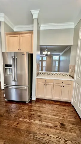 a kitchen with stainless steel appliances a refrigerator sink and cabinets