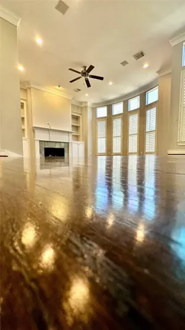 a view of a hall with wooden floor