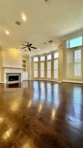 a view of a room with pool table and windows