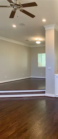 a view of a room with window and wooden floor