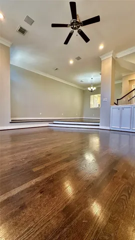 a view of room and with ceiling fan