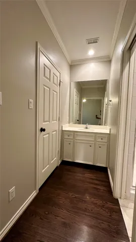 a bathroom with a double vanity sink and mirror