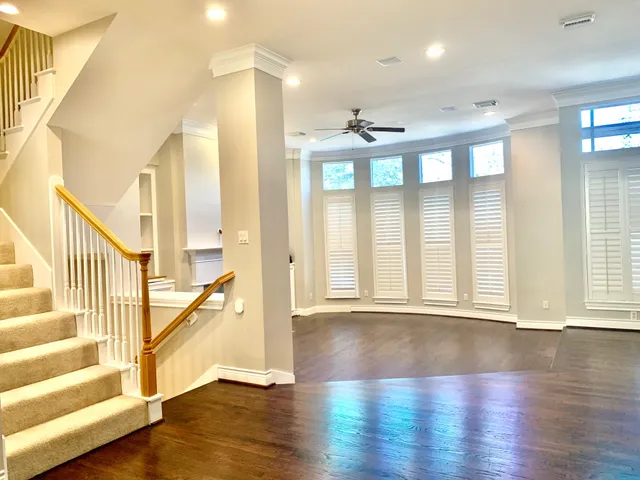 a view of an entryway with wooden floor and door