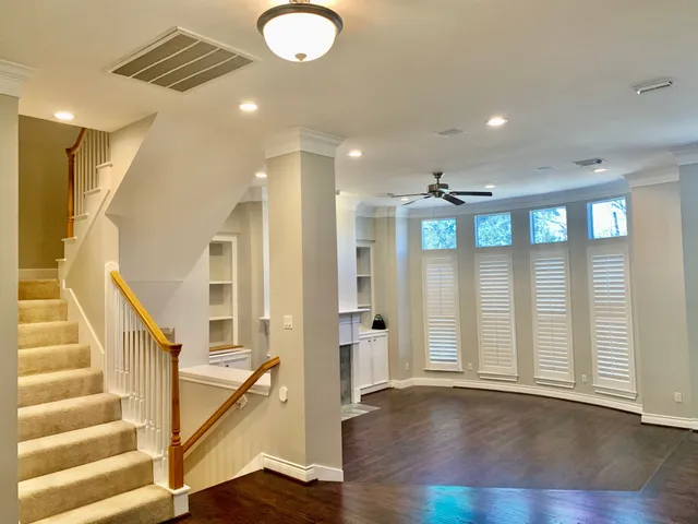 a view of an entryway with wooden floor and windows