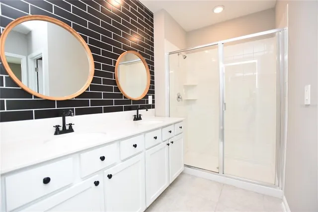 a bathroom with a mirror and a sink