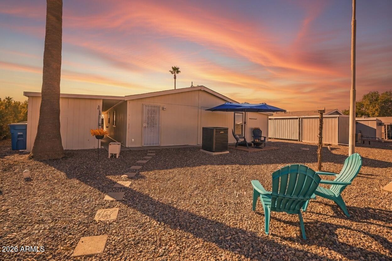 834 South Meridian Road, Unit 81 Apache Junction, AZ 85120 - Photo 20 of 22 a view of a house with backyard and sitting area