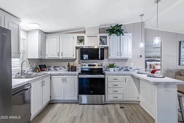 a kitchen with a sink stove and cabinets