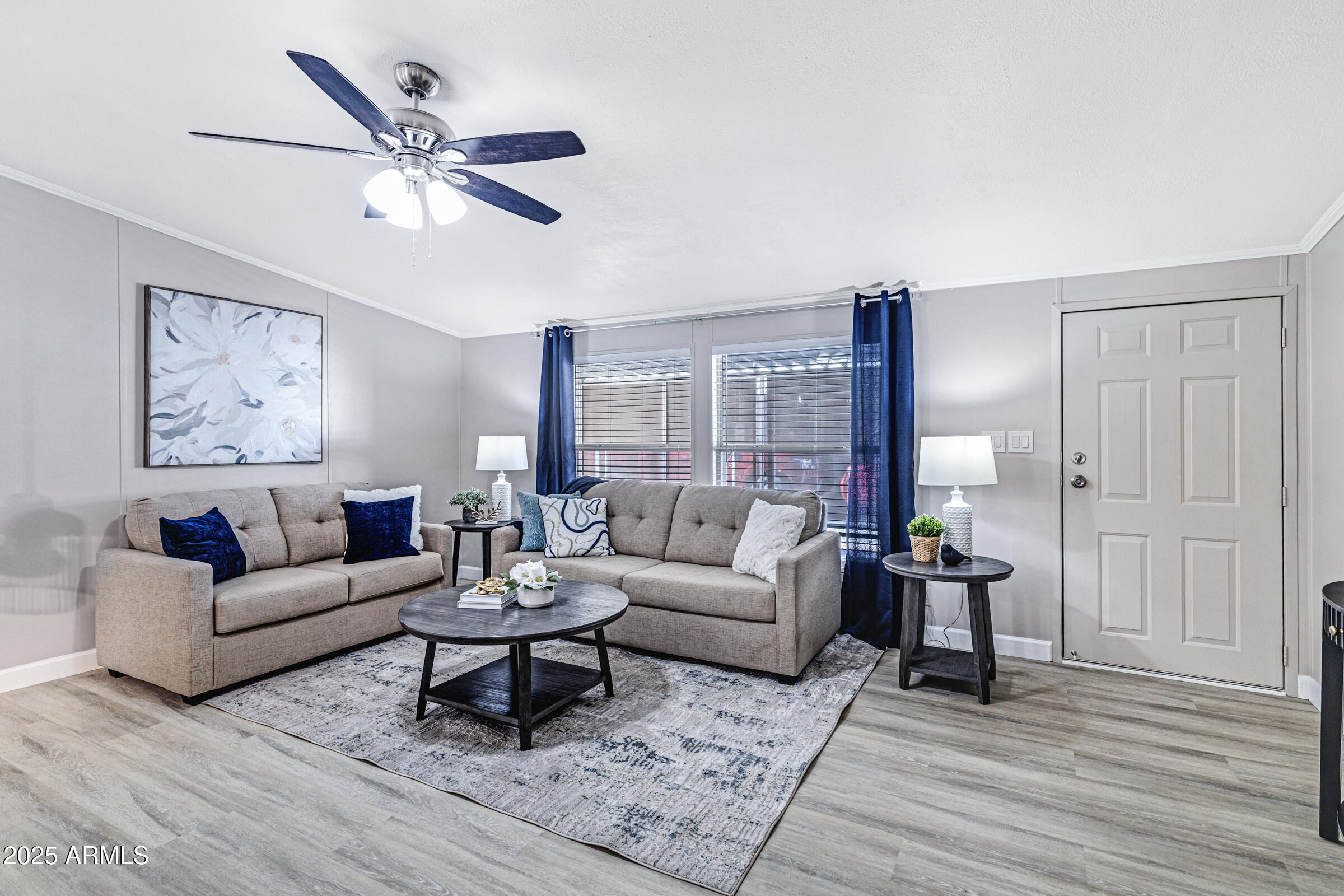834 South Meridian Road, Unit 81 Apache Junction, AZ 85120 - Photo 8 of 22 a living room with furniture and wooden floor