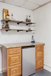 a kitchen with a cabinets and wooden floor