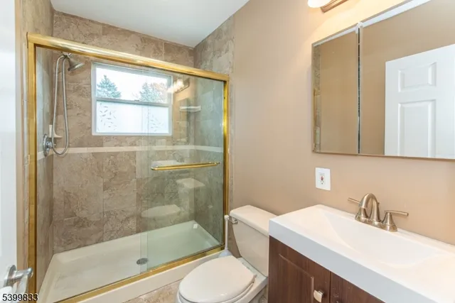 an aerial view of residential houses with outdoor space and lake view