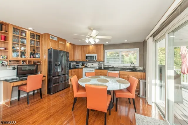 a living room with fireplace furniture and a large window