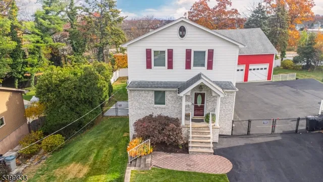 a view of house with yard