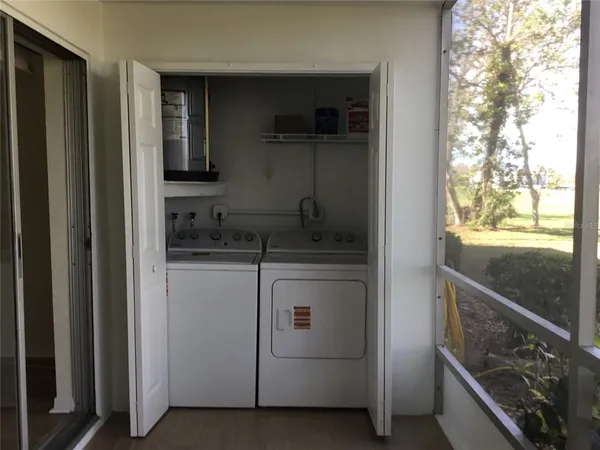a kitchen with a refrigerator and a sink