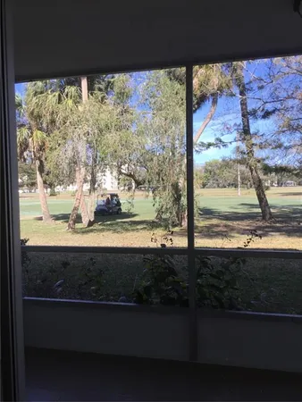 a view of a yard with an outdoor space
