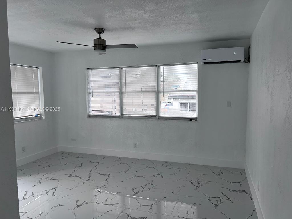 1131 Southwest 7th Street, Unit 3 Miami, FL 33130 - Photo 4 of 7 an empty room with a window