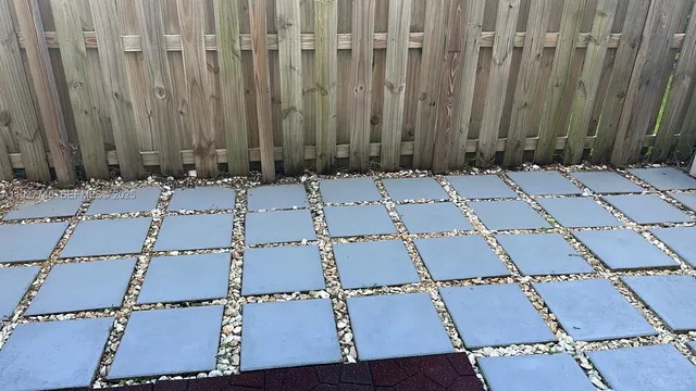 an aerial view of a house with a wooden fence