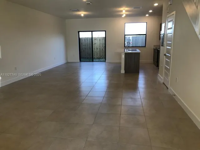 a view of a kitchen with a sink