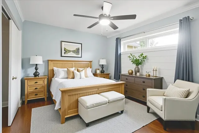 a spacious bedroom with a bed and a couch