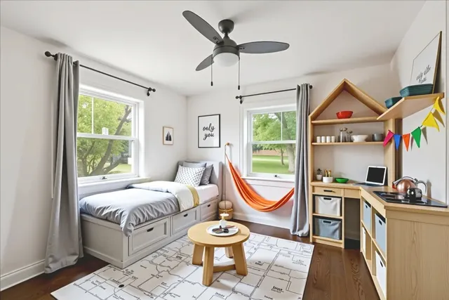 a living room with furniture a flat screen tv and a large window