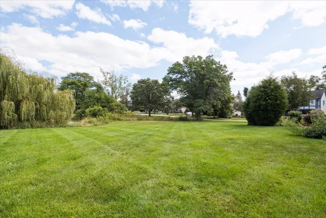 a view of outdoor space with deck and yard