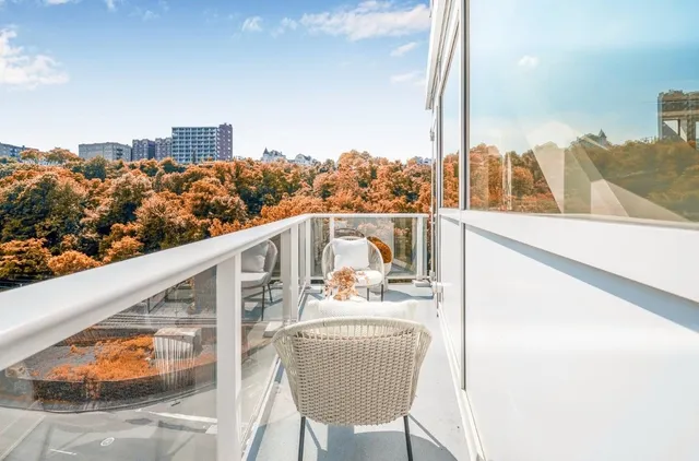 a balcony with an outdoor seating
