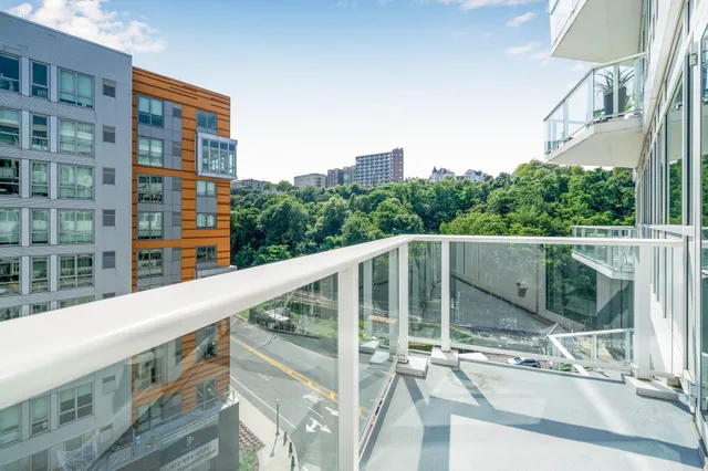a balcony with view of swimming pool