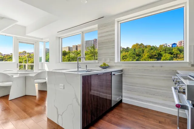 a kitchen with a sink and large window