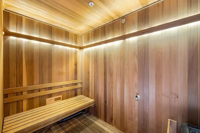 a view of a room with stairs and wooden floor