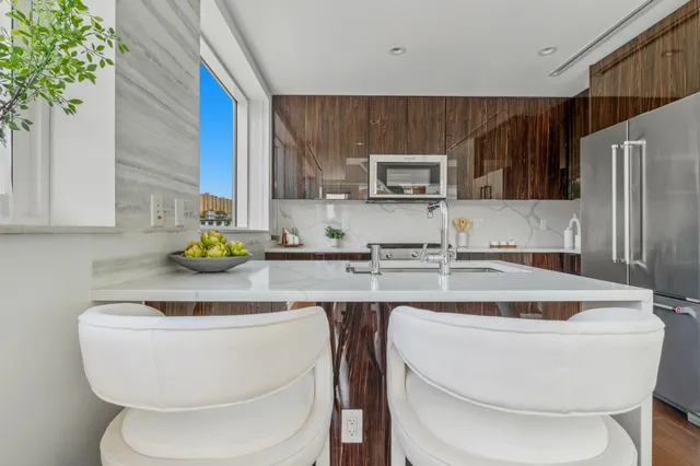 a kitchen with a sink and a refrigerator