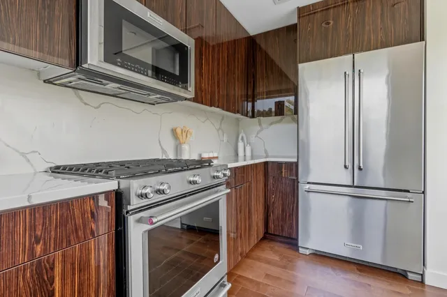 a kitchen with a stove microwave and refrigerator