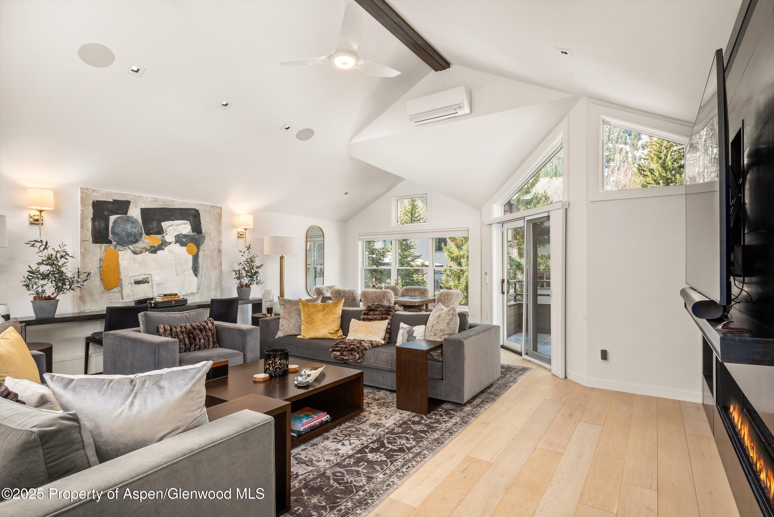 929 East Durant Avenue, Unit 4 Aspen, CO 81611 - Photo 15 of 43 a living room with furniture and a flat screen tv