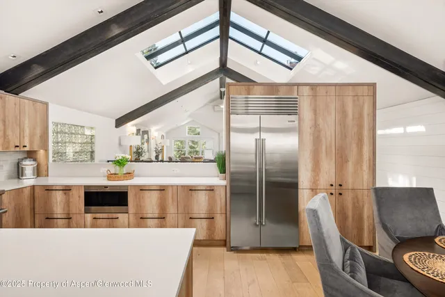 a bedroom with a bed and a chair