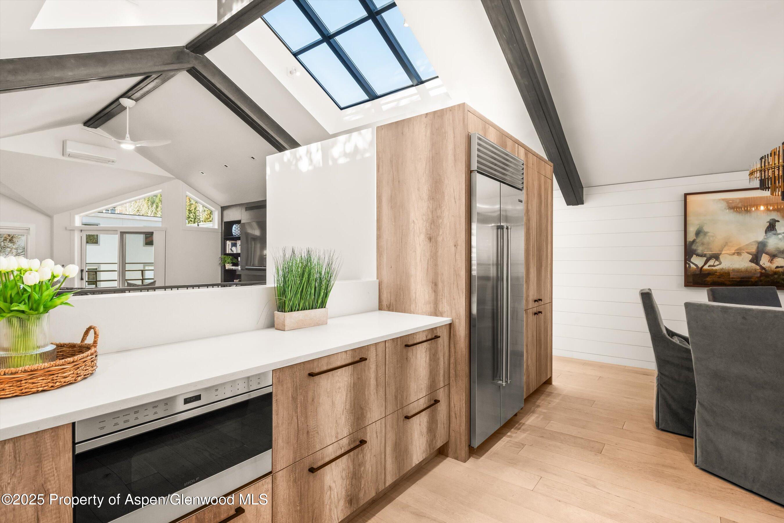 929 East Durant Avenue, Unit 4 Aspen, CO 81611 - Photo 23 of 43 a spacious bathroom with a granite countertop sink a mirror and a shower