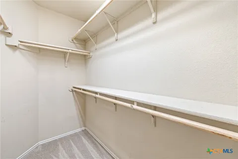 a view of a room with racks on the wall