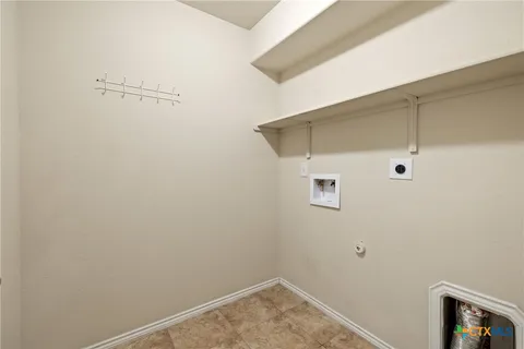 a bathroom with a sink toilet double vanity and shower