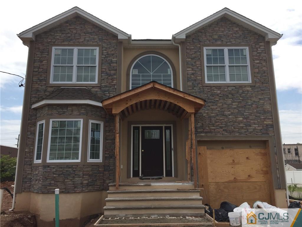 162 Larch Street Port Reading, NJ 07064 - Photo 1 of 9 a front view of a house