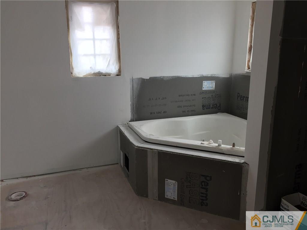 162 Larch Street Port Reading, NJ 07064 - Photo 6 of 9 a bathroom with a bathtub