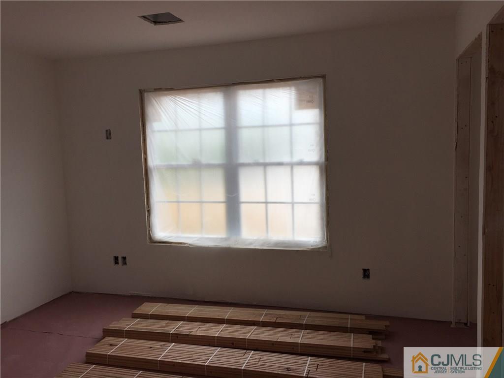 162 Larch Street Port Reading, NJ 07064 - Photo 7 of 9 a room with a window