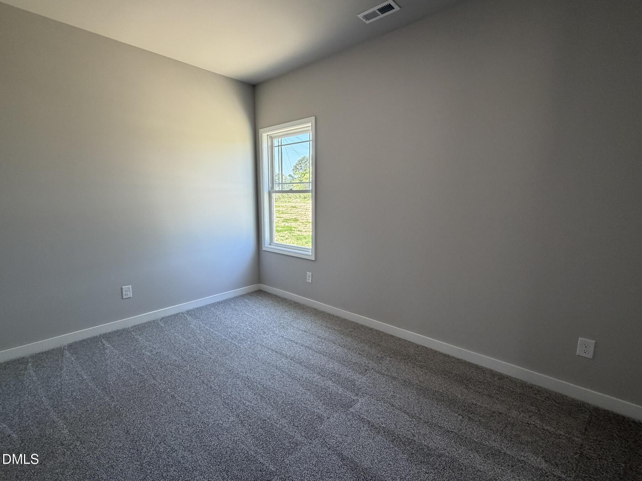 25 Jacobs Ridge Drive Four Oaks, NC 27524 - Photo 15 of 18 an empty room with a window