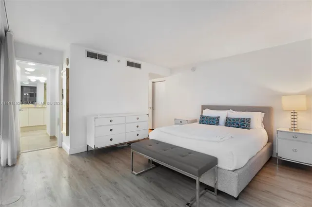 a bedroom with a bed and a view of bathroom