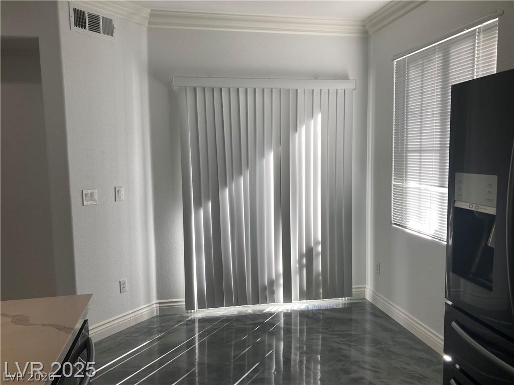 9050 West Warm Springs Road, Unit 1027 Las Vegas, NV 89148 - Photo 10 of 44 Natural light dances across the floor, highlighting modern design elements in this flexible living space.