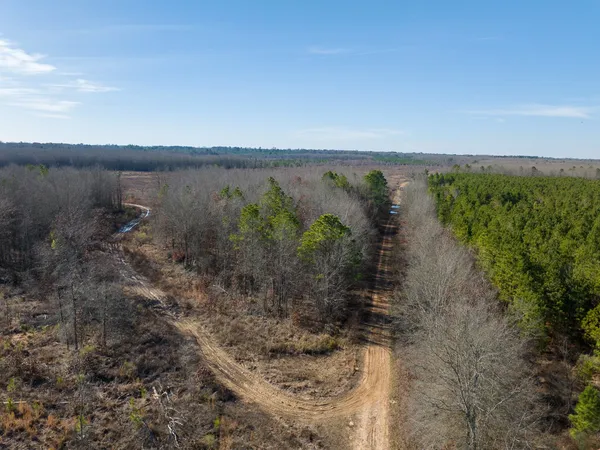 a view of a lake with a yard