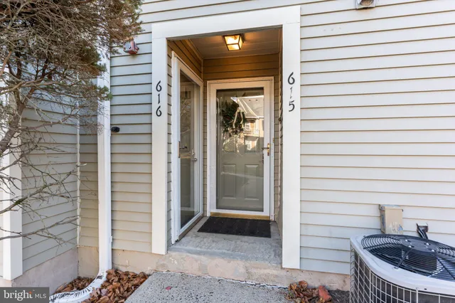 a view of a porch with a door and a chair